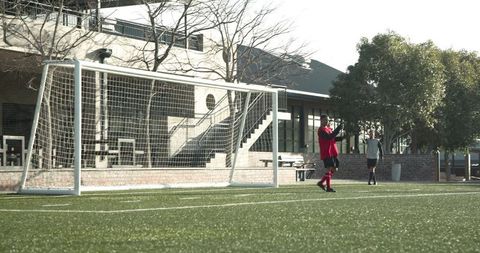 Soccer Players Practicing on Field Sie Preparing for Game