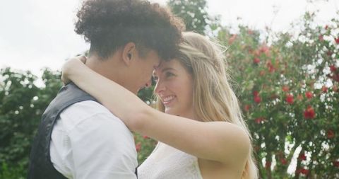 Romantic Moment: Happy Couple Embracing Outdoors on Wedding Day