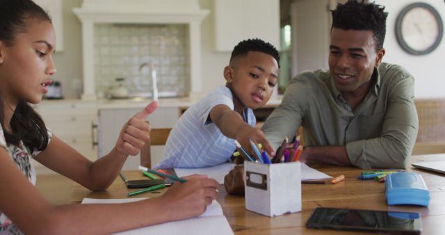 Father Helping Children with Homework at Home - Download Free Stock Images Pikwizard.com