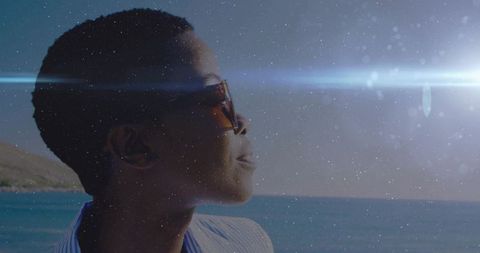 Woman in Sunglasses Enjoying Peaceful Ocean View