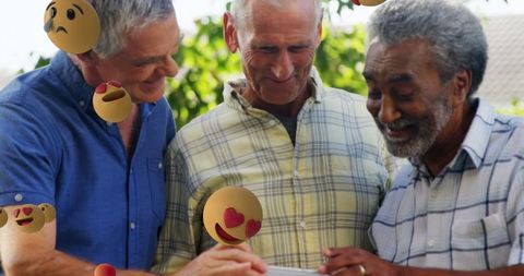 Seniors Enjoying Technology with Playful Emoji Overlays