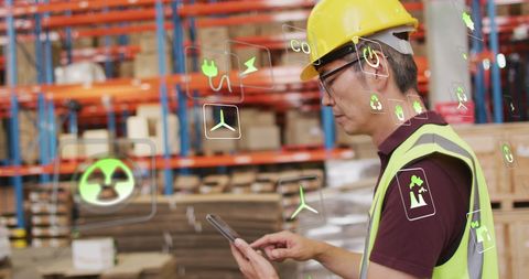 Warehouse Worker Analyzing Green Technology Data With Tablet - Download Free Stock Images Pikwizard.com