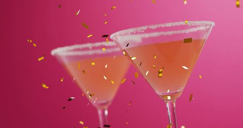 Glittering Confetti and Cocktails Against a Pink Background Celebrating - Download Free Stock Images Pikwizard.com