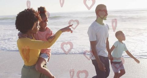 Family enjoying sunny day at beach with children