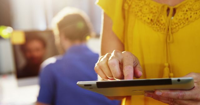 Woman in Yellow Blouse Using Tablet in Office Environment - Download Free Stock Images Pikwizard.com