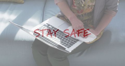 Safety Message with Woman Cleaning Laptop Keyboard