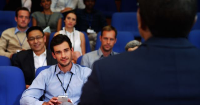 Audience Members Engaging with Speaker During Conference - Download Free Stock Images Pikwizard.com