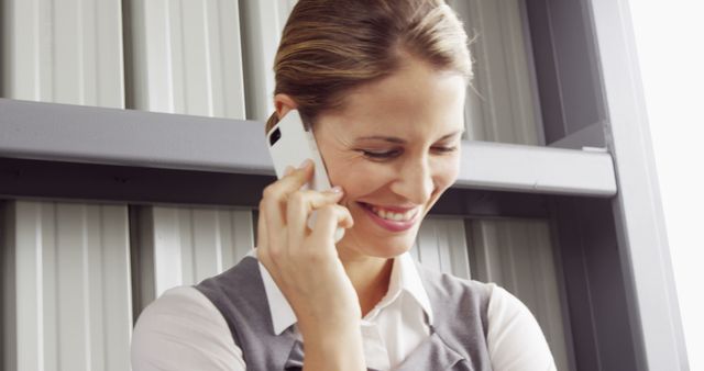 Smiling Businesswoman on Phone Call in Office Environment - Download Free Stock Images Pikwizard.com