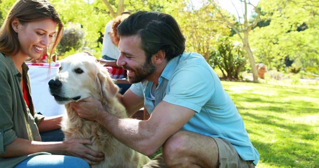 Couple petting a dog in park on a sunny day 4k - Download Free Stock Photos Pikwizard.com