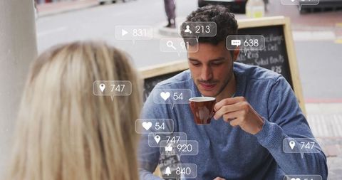 Couple Engaging over Coffee with Social Media Interface Overlay