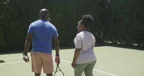 Senior African American Couple Enjoying Tennis on Sunny Day