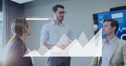 Colleagues discussing ideas with data graphics in modern office