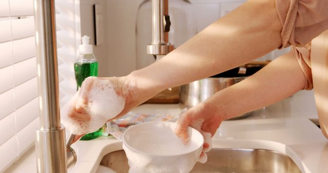 Close-up of Person Washing Dishes at Kitchen Sink - Download Free Stock Images Pikwizard.com