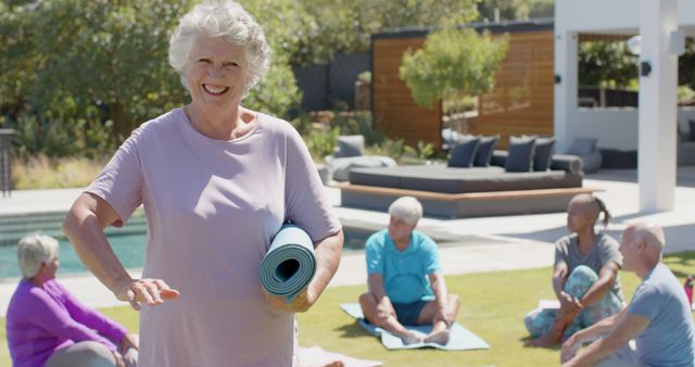 Senior Woman Smiling With Yoga Mat in Outdoor Group Yoga Session - Download Free Stock Images Pikwizard.com