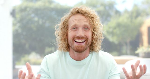 Happy Redheaded Man with Curly Hair Laughing Outdoors - Download Free Stock Images Pikwizard.com