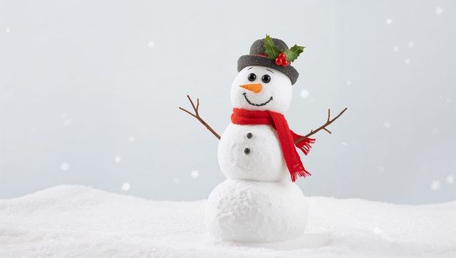 Whimsical three-tier snowman wearing gray hat with holly and red scarf on snowy background