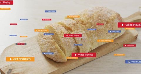 Rustic crusty loaf resting on wooden board with colorful social media notification badges