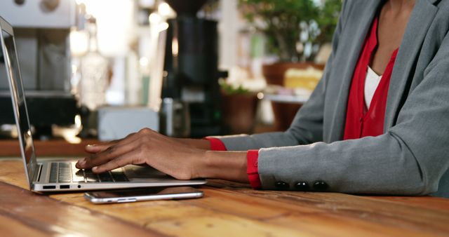 Professional Person Working on Laptop in Coffee Shop - Download Free Stock Images Pikwizard.com