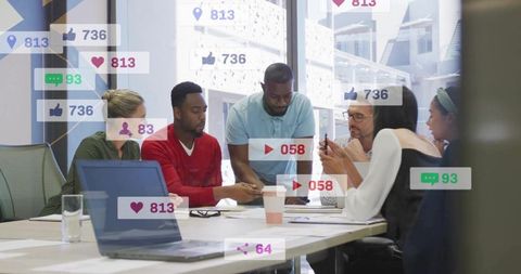 Diverse team collaborating with social media integration in modern office