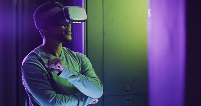 African american male computer technician using vr headset working in business server room - Download Free Stock Photos Pikwizard.com