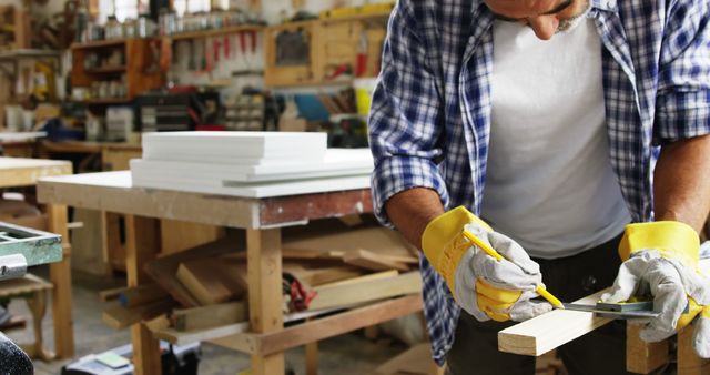 Carpenter Measuring Wood in Workshop with Precision - Download Free Stock Images Pikwizard.com