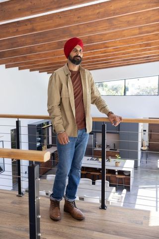 Indian Man with Red Turban in Modern Home Interior
