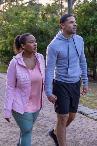 Couple Enjoying Morning Walk in Scenic Park