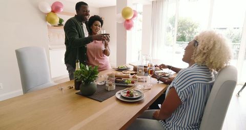 Group of Friends Enjoying Brunch Together at Home Celebration