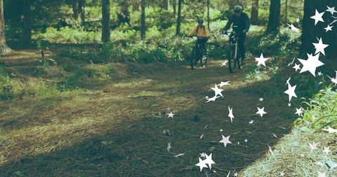 Couple mountain biking through scenic forest trail with magic touch