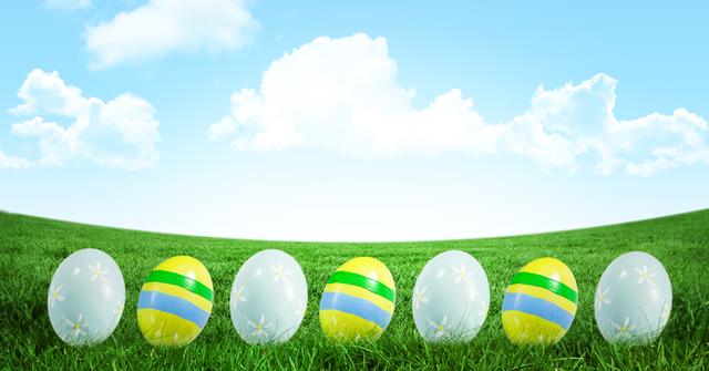 This scene depicts colorful Easter eggs neatly placed on fresh green grass against a clear blue sky with fluffy clouds. Ideal for use in holiday greeting cards, seasonal advertisements, festive social media posts, or as a cheerful Easter decoration.