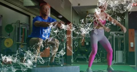 Athletic duo performing box jumps with digital network overlay for high-intensity training