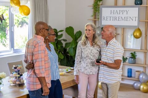 Senior Couples Celebrating Retirement at Home Gathering
