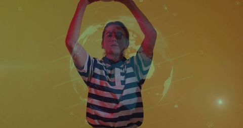 Person interacting with holographic globe interface in futuristic setting