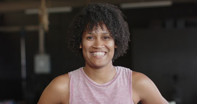 Smiling Woman with Curly Hair in Gym - Download Free Stock Images Pikwizard.com