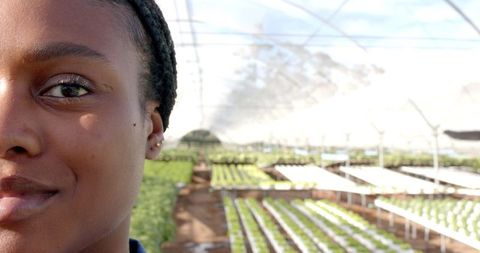 Woman in hydroponic farm emphasizing sustainable agriculture