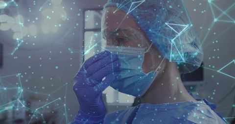 Surgeon adjusting mask with holographic medical data overlay in sterile operating room