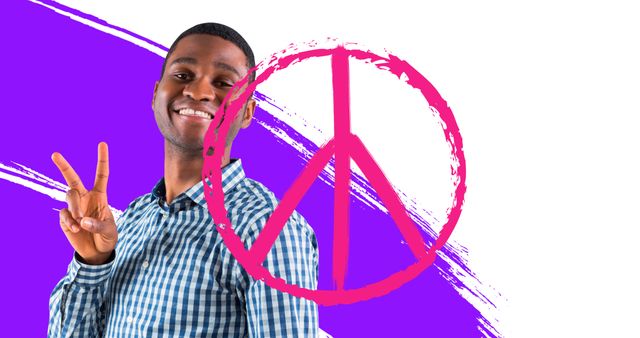 Digital portrait of smiling african american young man gesturing peace with symbol, copy space. International day of peace, avoid war and violence, celebration, hope, kindness, support.