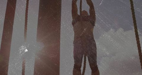 Determined Woman Tackling Ropes on Outdoor Obstacle Course
