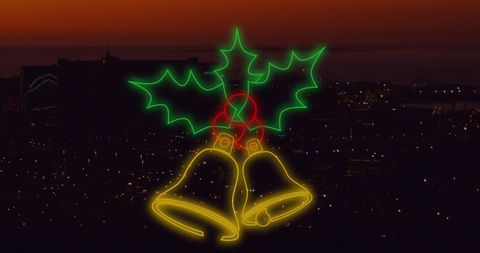 Neon Christmas Holly and Bells Over Cityscape at Dusk