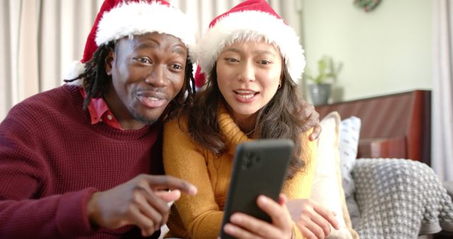 Diverse Couple Video Calling with Santa Hats During Christmas - Download Free Stock Images Pikwizard.com