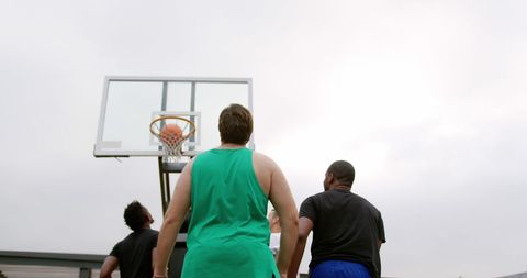 Diverse Basketball Team Engaging in Outdoor Game