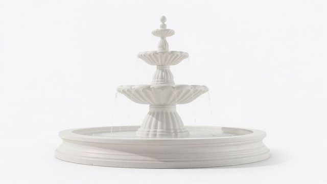 Three-tier fountain with flowing water on white background