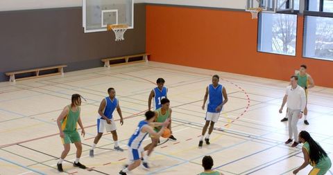 Youth Basketball Team Competing in Indoor Sports Hall