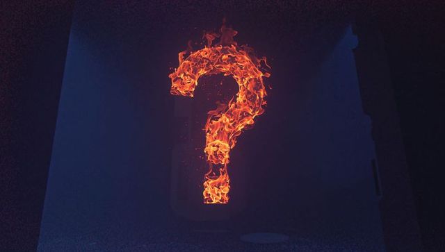 Burning Question Mark: Enigmatic Flaming Symbol in Smoky Ambience