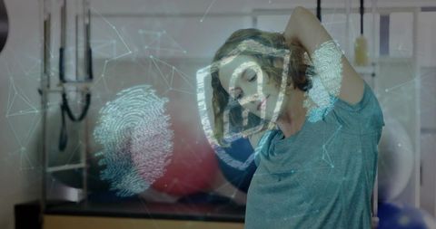 Woman stretching neck in rehab studio with biometric shield overlay and fingerprint network