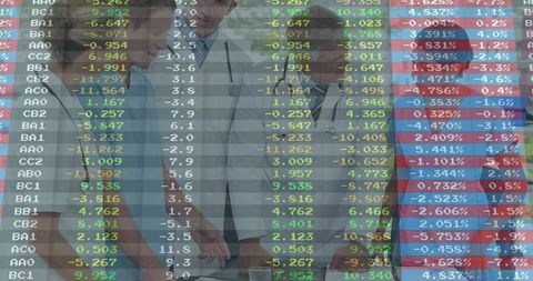 Healthcare Professionals Discussing Financial Data in Modern Office