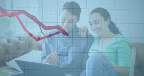 Couple Analyzing Financial Data on Laptop with Graph Overlay