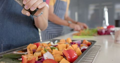 Couple Prepares Fresh Vegetables in Modern Kitchen