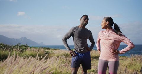 Fit Couple Laughing Exercising in Scenic Countryside