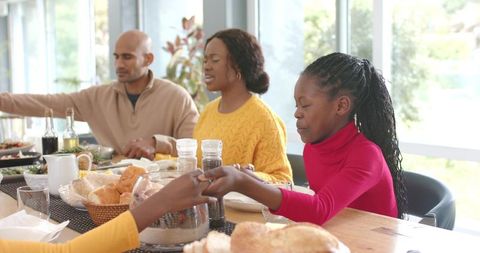 Family Sharing Brunch at Sunlit Table, Child Reaching for Bread, Passing Dishes